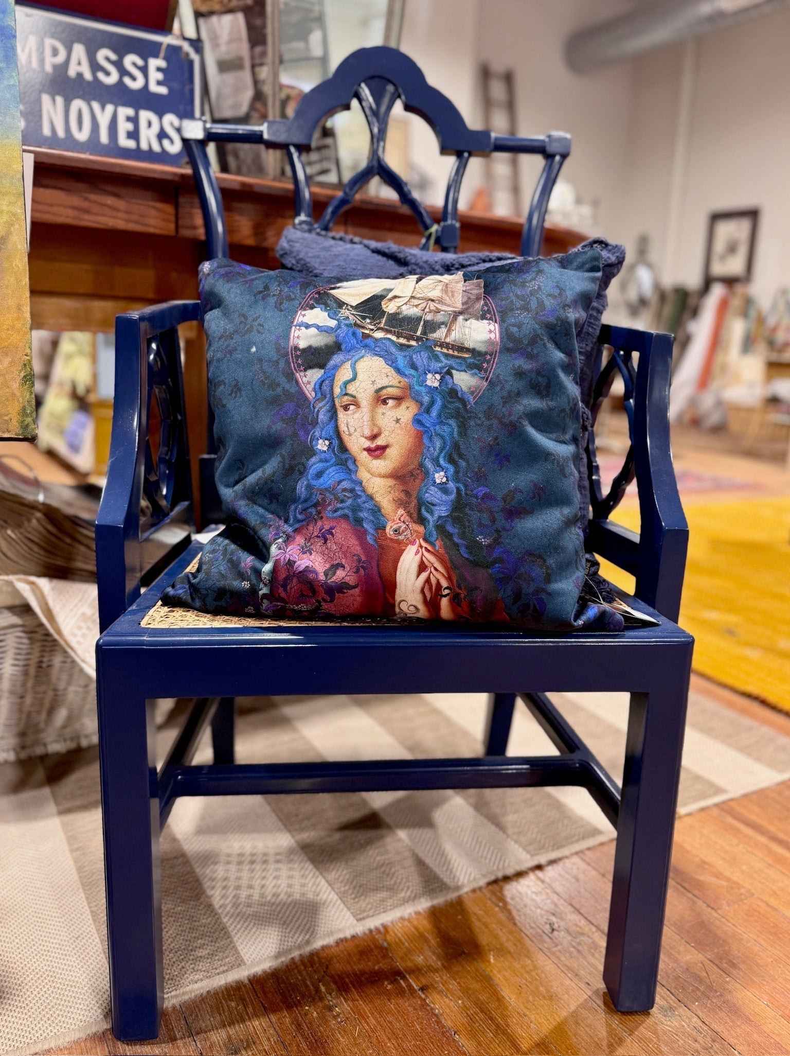 Voglio Bene pillow on blue antique chair